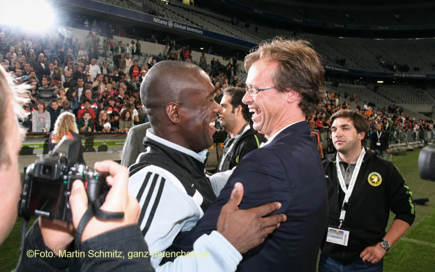 Chris Vermeeren and Clarence Seedorf greeting each other on the pitch during Goal4Africa in 2008.